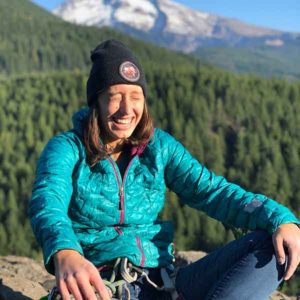 Elise Scribner wilderness therapist experiencing the joy of rock climbing.